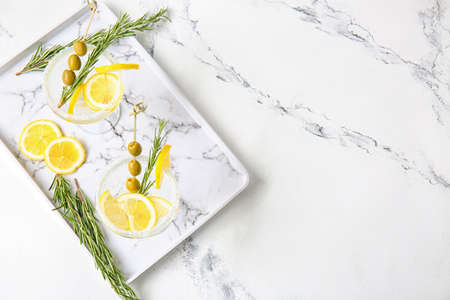 Glasses of tasty martini cocktail on tableの写真素材