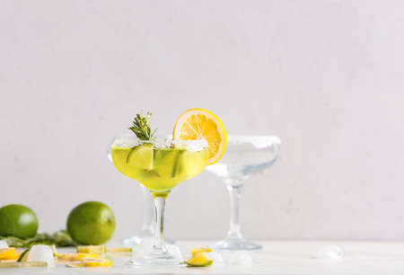 Glass of tasty martini cocktail on tableの写真素材