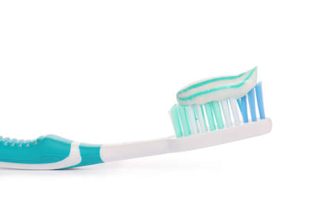 Tooth brush with paste on white background
