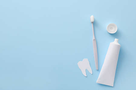 Tooth brush and paste on color backgroundの写真素材