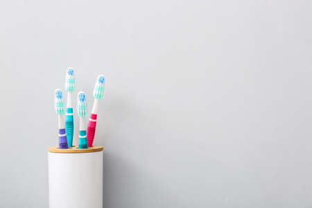 Tooth brushes on gray backgroundの写真素材