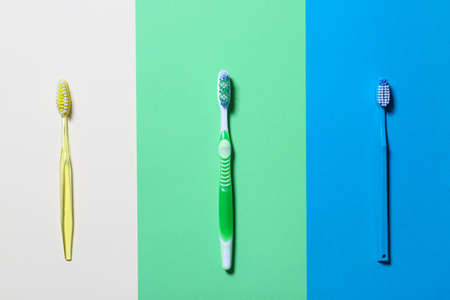 Tooth brushes on color backgroundの写真素材