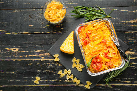 Tasty baked pasta in dish on table