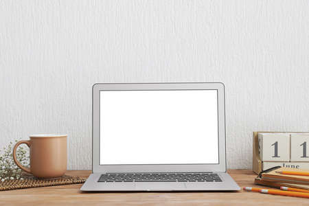 Modern laptop with blank screen on tableの写真素材