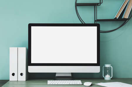 Modern PC monitor with blank screen on table