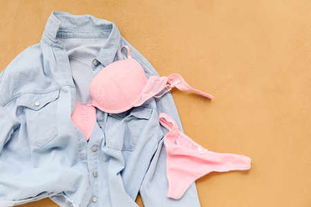 Stylish female clothes and underwear on color backgroundの写真素材