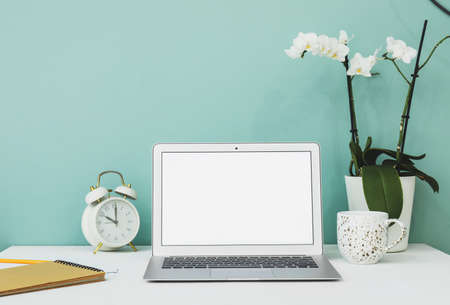 Modern laptop with blank screen on tableの写真素材