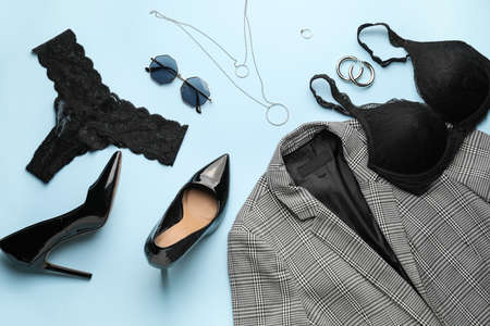 Stylish female clothes and accessories on color backgroundの写真素材