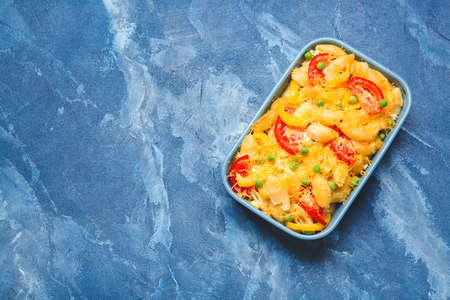 Tasty baked pasta in dish on color backgroundの写真素材