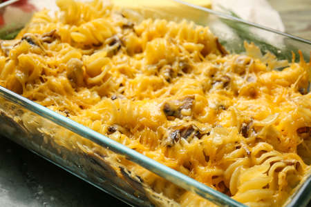 Tasty baked pasta in dish on table, closeupの写真素材