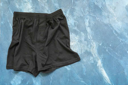 Stylish male trunks on color backgroundの写真素材