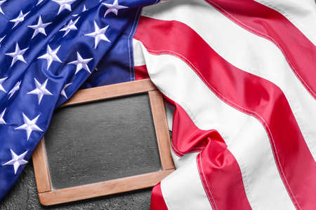 USA flag and chalkboard on dark backgroundの写真素材