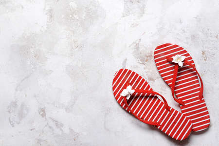 Stylish flip-flops on light backgroundの写真素材