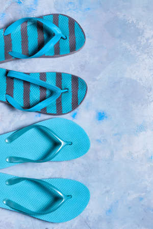Stylish flip-flops on color backgroundの写真素材