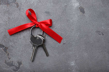 Keys with bow on dark backgroundの写真素材