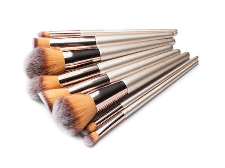 Set of makeup brushes on white background