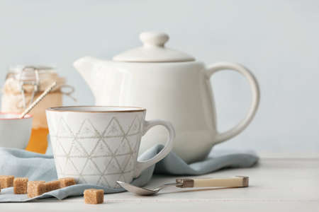 Composition with hot tea on tableの写真素材