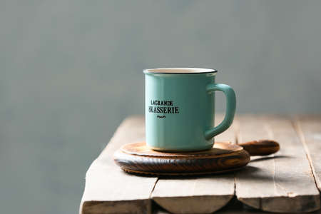 Cup of hot tea on table