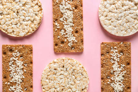 Healthy crispbreads on color background