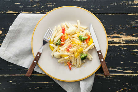 Plate with tasty pasta primavera on tableの写真素材