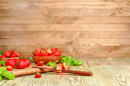 Composition with fresh ripe strawberry on tableの写真素材