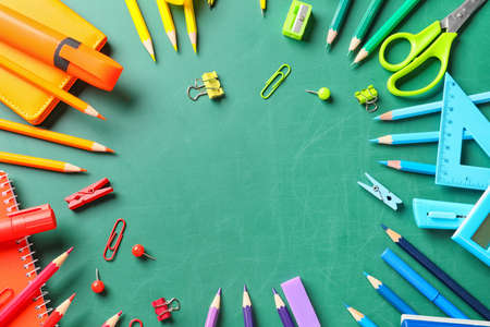 Frame made of school stationery on blackboardの写真素材
