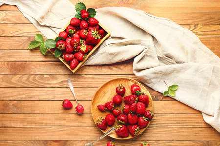 Composition with fresh ripe strawberry on tableの写真素材