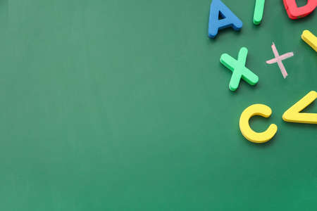 Letters and mathematical signs on color background