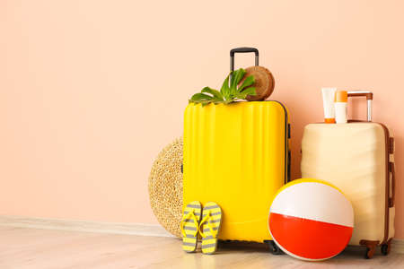 Packed luggage near color wall. Travel conceptの写真素材