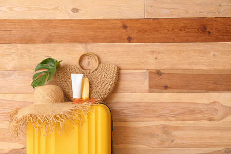 Packed luggage near wooden wall. Travel conceptの写真素材