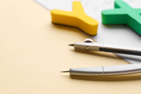 Pair of compasses on color background, closeupの写真素材