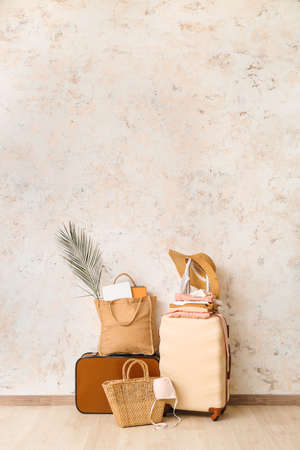 Packed luggage near light wall. Travel conceptの写真素材