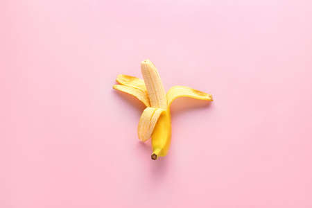 Ripe banana on color backgroundの写真素材