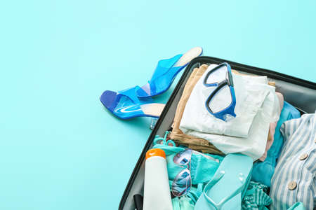 Packed luggage on color background. Travel conceptの写真素材