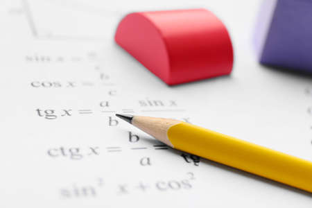 Pencil and paper with mathematical formulas, closeupの写真素材