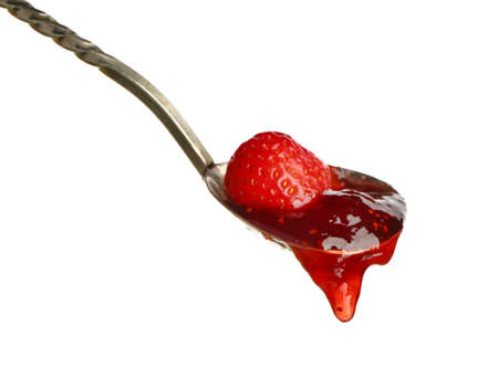 Spoon with tasty strawberry jam on white backgroundの写真素材