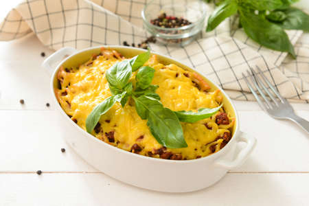 Baking dish with tasty beef casserole on tableの写真素材