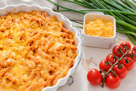 Baking dish with tasty beef casserole on white backgroundの写真素材