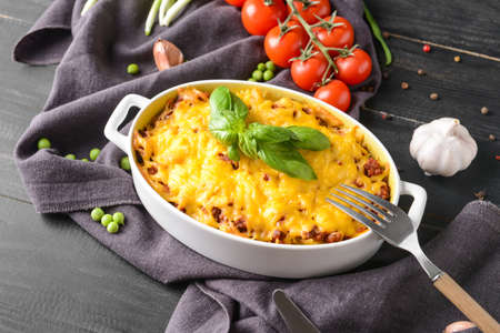 Baking dish with tasty beef casserole on tableの写真素材