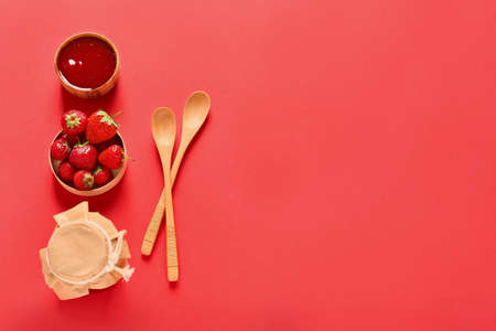 Tasty strawberry jam on color backgroundの写真素材