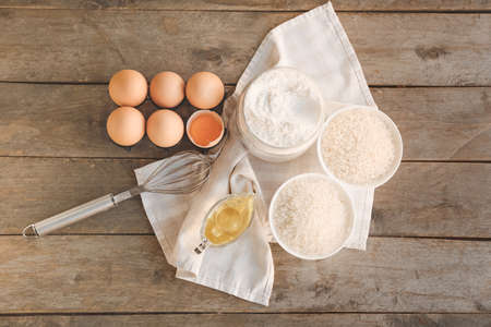 Rice with flour and products on table