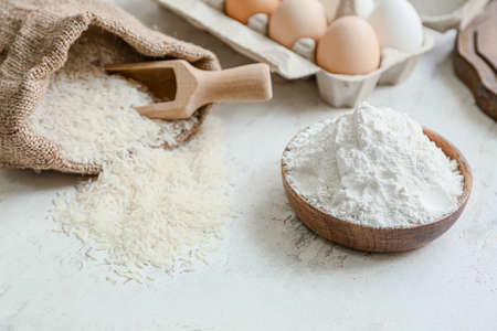 Plate with rice flour on white tableの写真素材