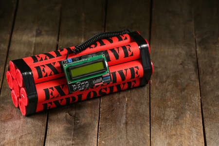 Bomb with timer on wooden backgroundの写真素材