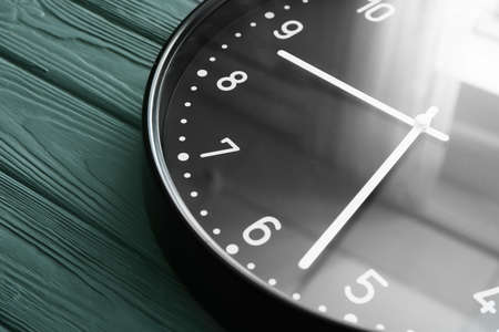 Simple clock on wooden background, closeupの写真素材