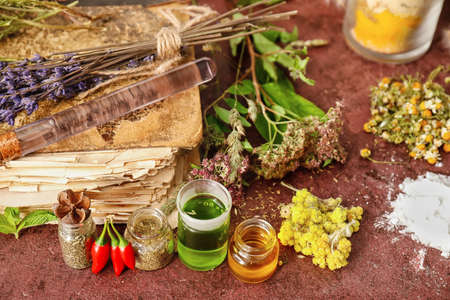 Ingredients for preparing potions on color backgroundの写真素材