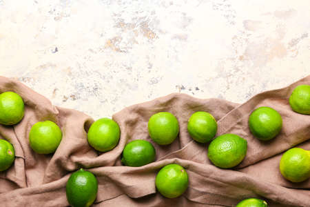 Fresh green limes on light background