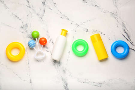 Sunscreen cream with toys on white backgroundの写真素材