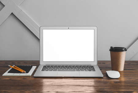 Modern laptop on table in room