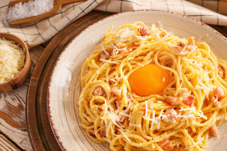 Plate with tasty pasta carbonara on table, closeupの写真素材