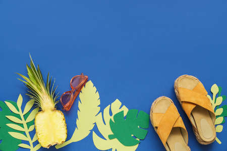 Composition with beach accessories on color background